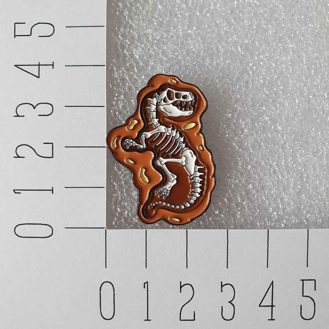 Enamel pin - Fossiel dino T. rex