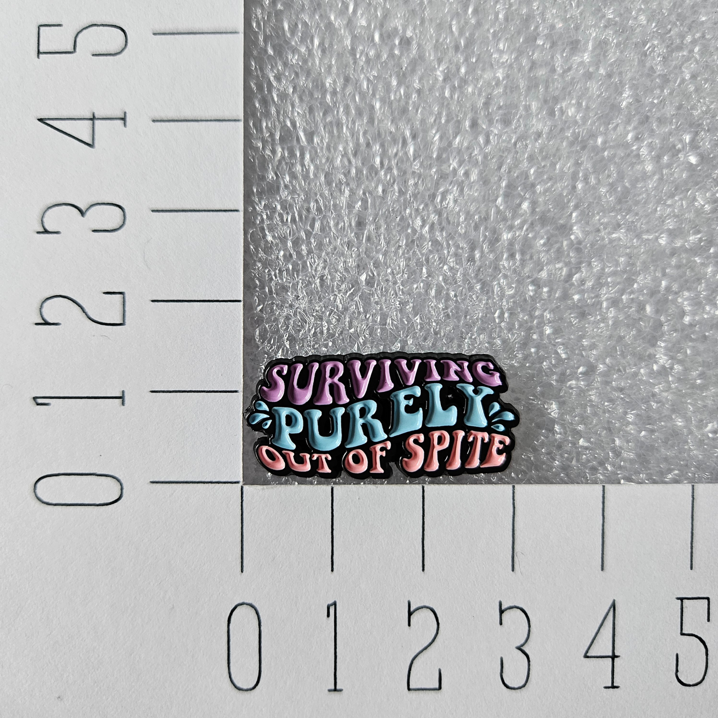 Enamel pin Surviving purely out of spite afmeting