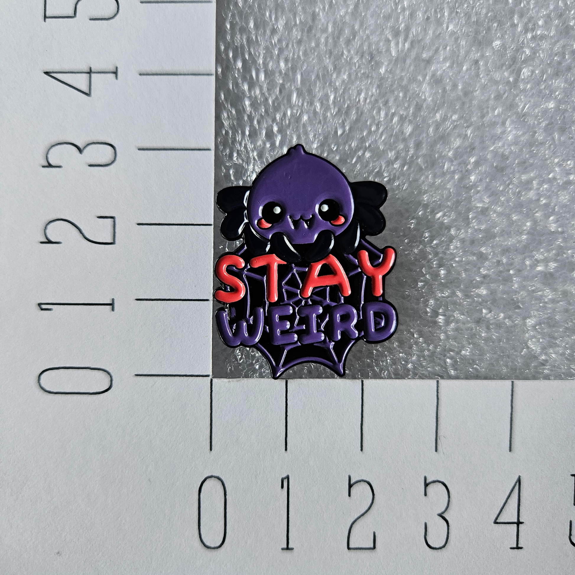 Enamel pin Spin stay weird